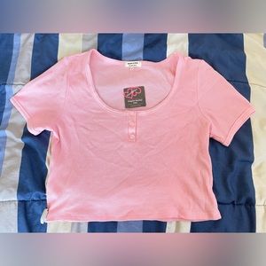 Pink waist length shirt w/ security tag!
